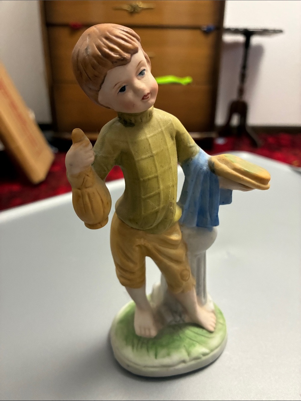 Ceramic boy figurine